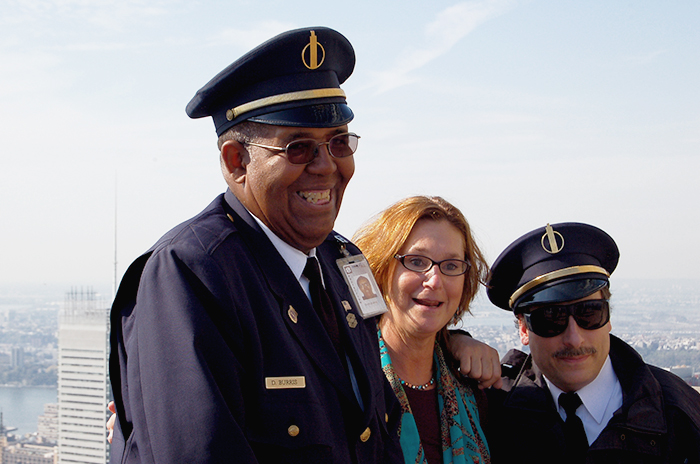 Tourist making a photo together with some security guards