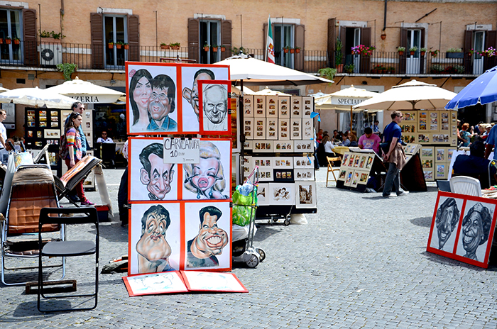 Portrait painters waiting for a tourist to pay them in Rome